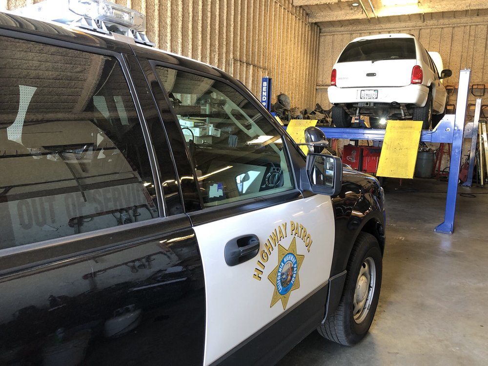 A patrol car parked in the service bay